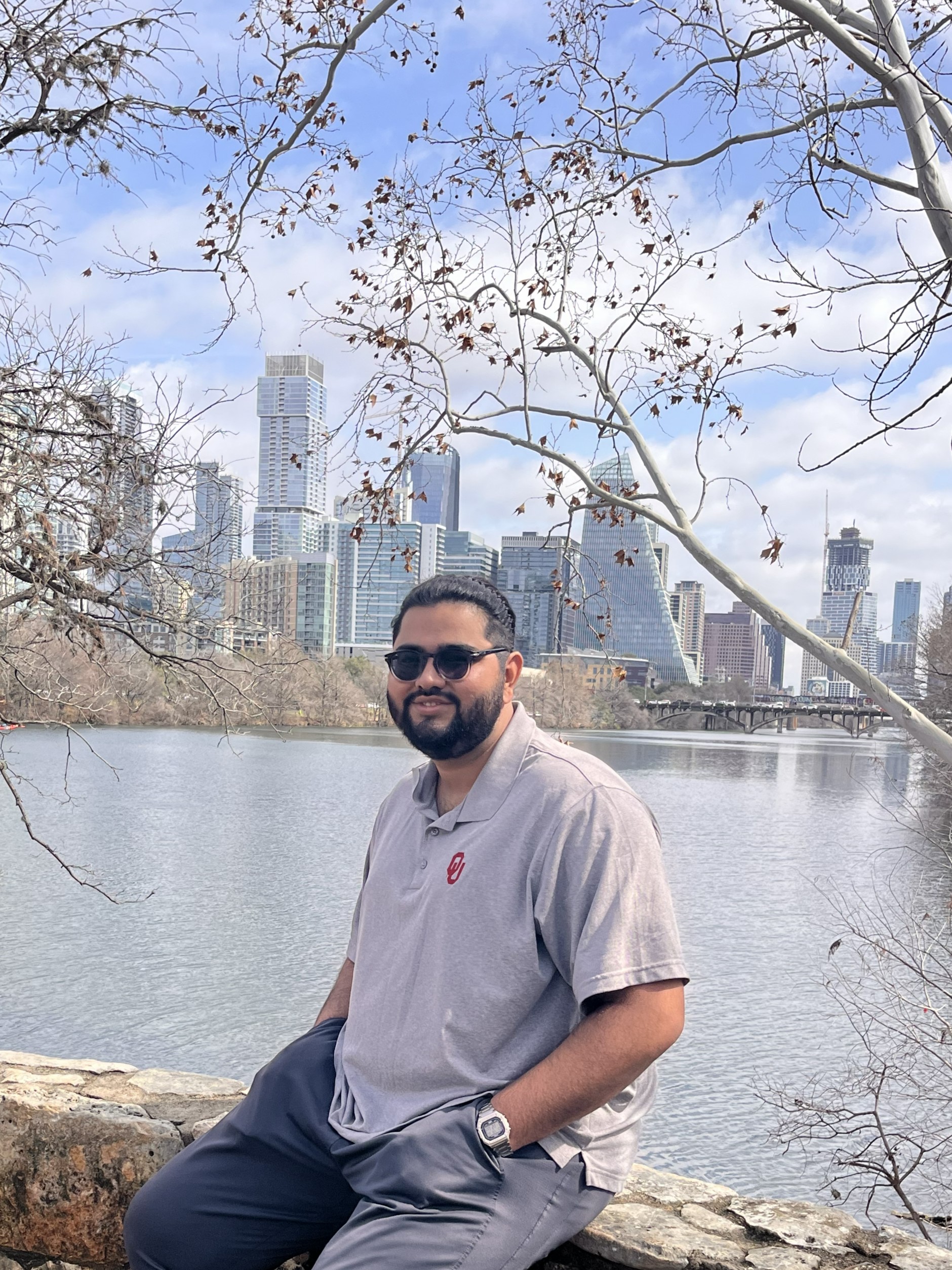 Mahad Imran outdoors with a city skyline in the background